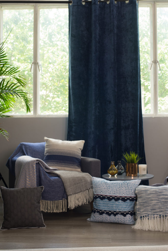 Telia showroom armchair with indigo curtains and textiles